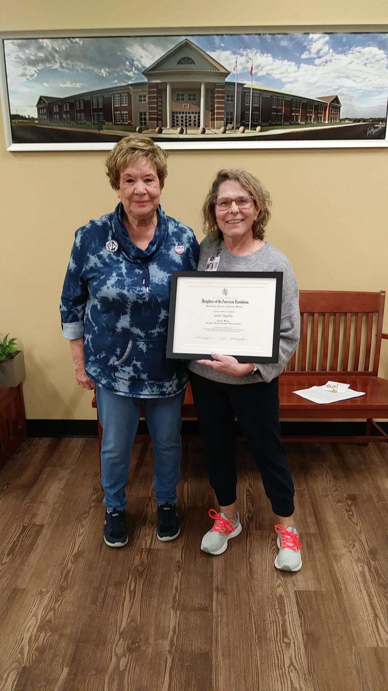 Brigadier General Richard Winn Chapter Historian Betty Chinery stands with Outstanding Teacher of the Year Jackie Zigelski.