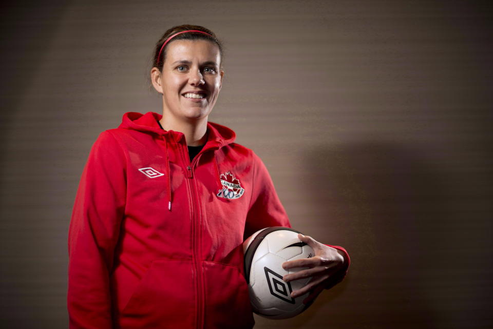 Canadian National Soccer team member Christine Sinclair poses for a photo in Richmond, B.C., Tuesday, Dec. 18, 2012. Sinclair, the top goal scorer in international soccer, has announced she will retire from the Canadian national team at the end of this season. Sinclair, 40, announced her decision Thursday night, Oct. 19, 2023, on Instagram in a video that showed a pair of cleats swinging in the breeze on a goal. (Jonathan Hayward/The Canadian Press via AP)