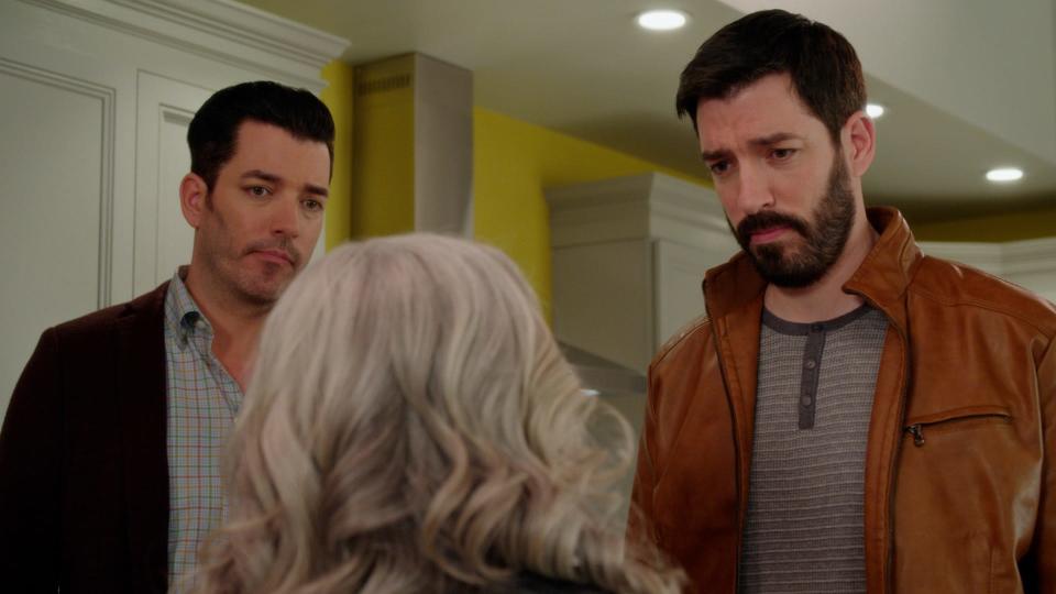 Gloria (Paula Pell, center) confronts brothers Jonathan, left, and Drew Scott after Girls5Eva gets snubbed by their record label.