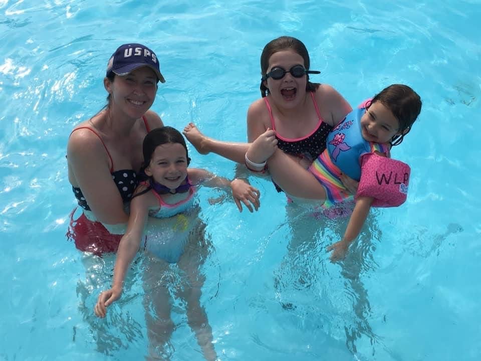 Lisa Galek and her children in the pool