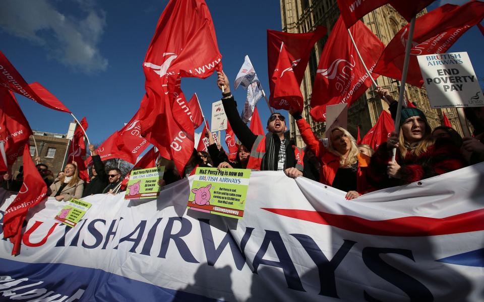 Now British Airways workers vote to strike - and target summer getaway for maximum impact - DANIEL LEAL /AFP