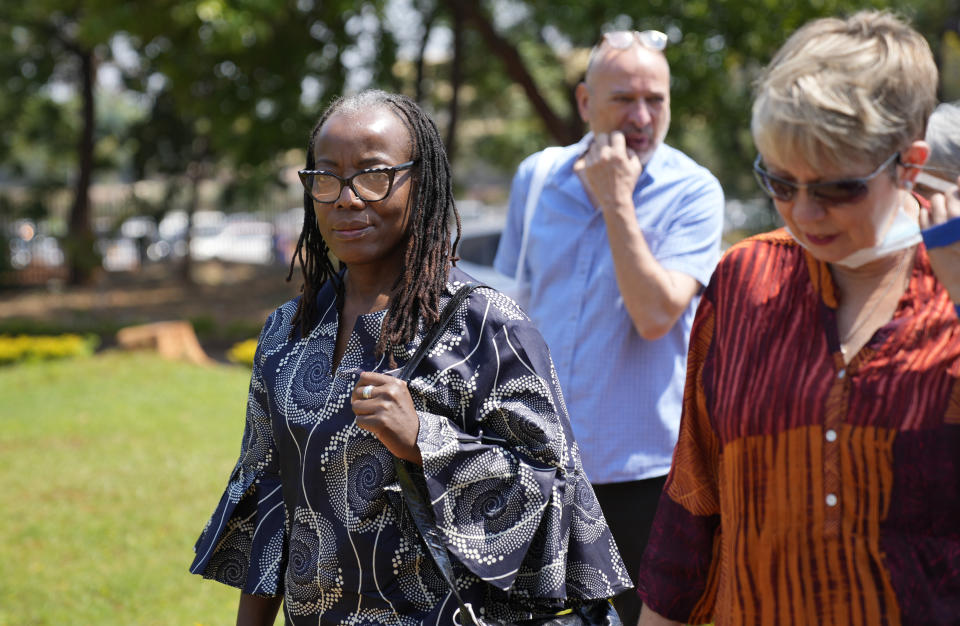 Zimbabwean writer Tsitsi Dangarembga, left, arrives at the magistrates courts in Harare, Thursday, Sept. 29, 2022. Dangarembga faces charges of inciting public violence for protesting against corruption and the rule of law in Zimbabwe.( AP Photo/Tsvangirayi Mukwazhi)