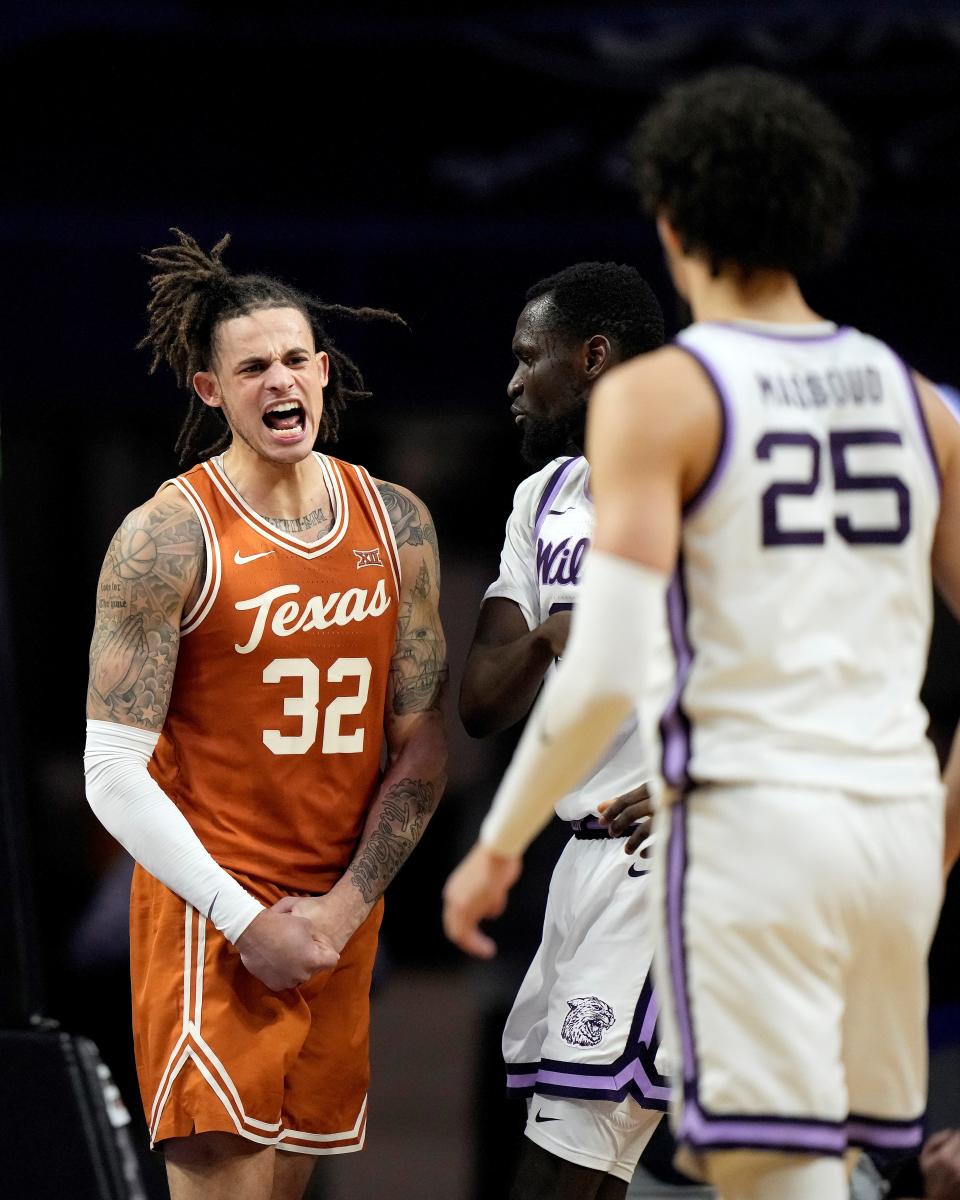 Texas forward Christian Bishop (32) celebrates after making a basket against Kansas State on Saturday at Bramlage Coliseum. Bishop scored all 14 of his points in the second half as the Longhorns rallied from an 11-point deficit to win, 69-66.