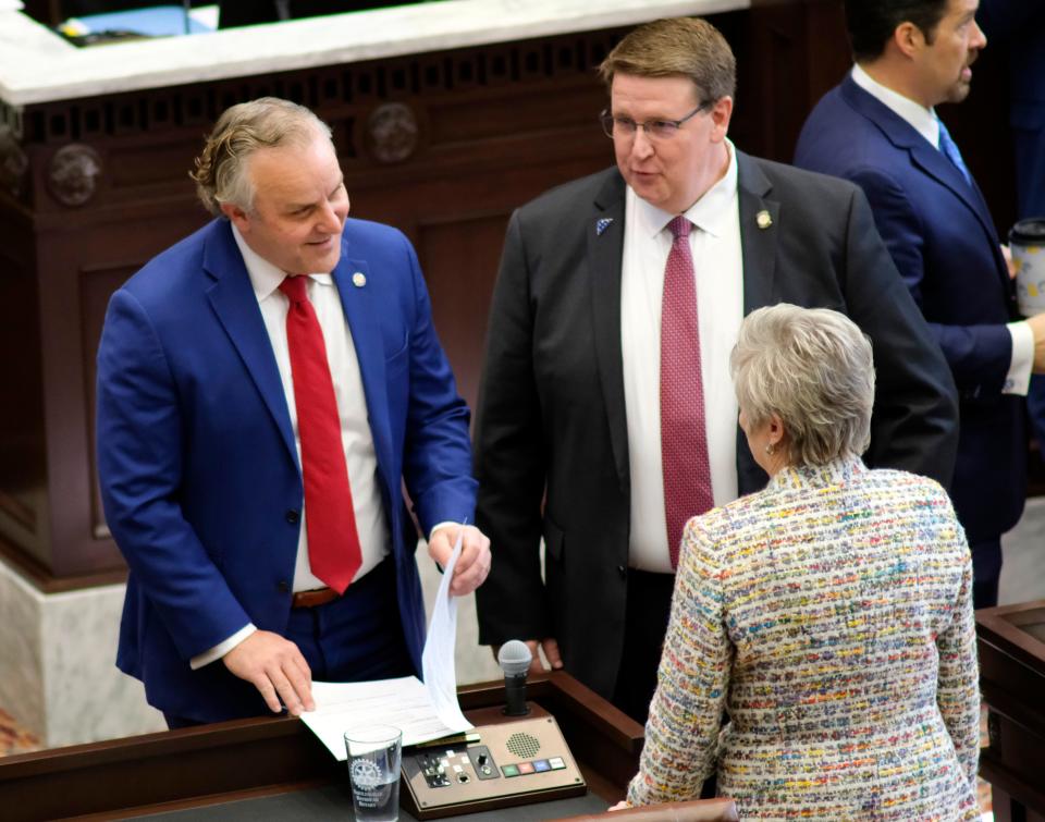 Senate President Pro Tempore Greg Treat, left, and Majority Floor Leader Greg McCortney talk with Sen. Julie Daniels, assistant majority whip of the Senate, on Jan. 3, 2023, at the state Capitol.