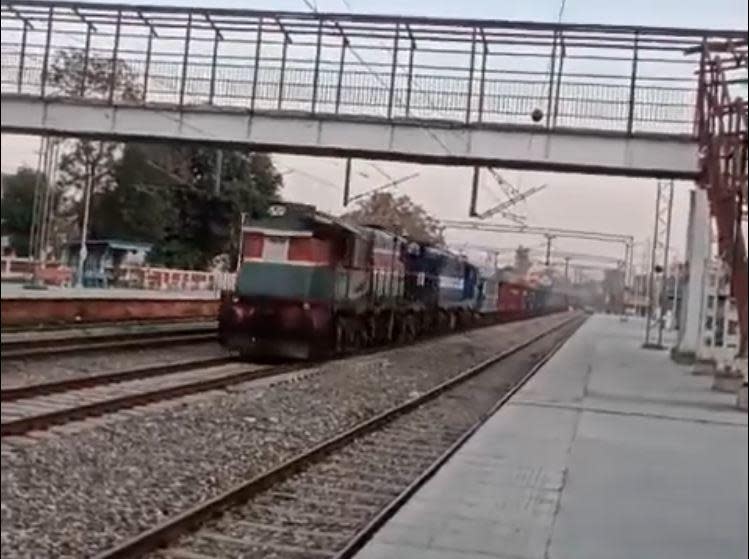 A screengrab from video shared widely by Indian media outlets, which CBS News could not independently verify, shows a 53-carriage freight train loaded with gravel barrelling through a station in northeast India on Feb. 25, 2023, after it was reportedly left without the brakes locked during a stop in Kathua and started rolling downhill. 