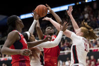 U.S. forward Nneka Ogwumike (16) shoots as Stanford forward Ashten Prechtel, right, and Stanford guard Kiana Williams, left, defend in the second quarter of an exhibition women's basketball game, Saturday, Nov. 2, 2019, in Stanford, Calif. (AP Photo/John Hefti)