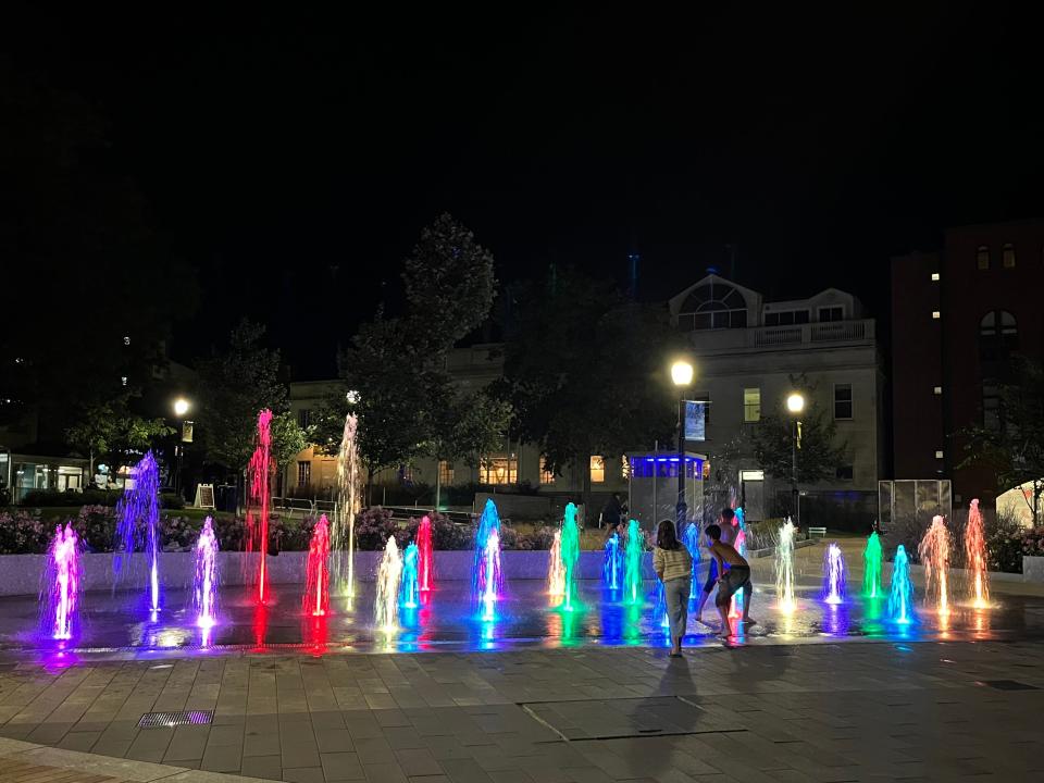 Kids play in the fountains in City Hall Park at night on Aug. 2, 2023. The park is officially open from 6 a.m. to midnight.
