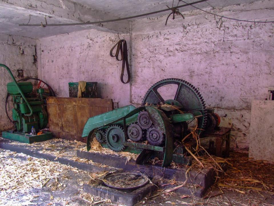 A machine for crushing sugar cane to make grogue on Santo Antão, the second-largest of Cabo Verde’s 10 islands. <a href="https://www.gettyimages.com/detail/news-photo/machine-for-crushing-sugar-cane-to-extract-the-sugar-for-news-photo/872096810?adppopup=true" rel="nofollow noopener" target="_blank" data-ylk="slk:Jon G. Fuller/VW Pics/Universal Images Group via Getty Images;elm:context_link;itc:0;sec:content-canvas" class="link ">Jon G. Fuller/VW Pics/Universal Images Group via Getty Images</a>