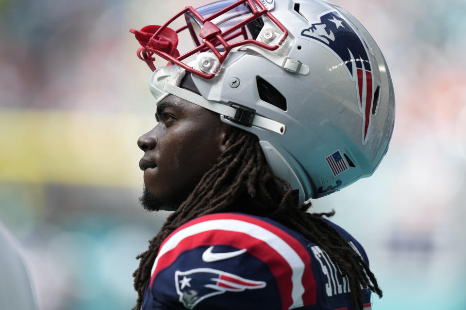 New England Patriots running back Rhamondre Stevenson watches from the sideline during the first half of an NFL football game against the Miami Dolphins, Sunday, Oct. 29, 2023, in Miami Gardens, Fla. (AP Photo/Lynne Sladky)