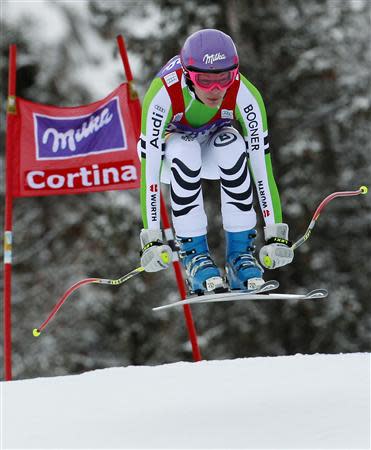Maria Hoefl-Riesch of Germany clears a gate during the women's FIS World Cup Downhill race in Cortina D'Ampezzo January 24, 2014. REUTERS/Alessandro Garofalo