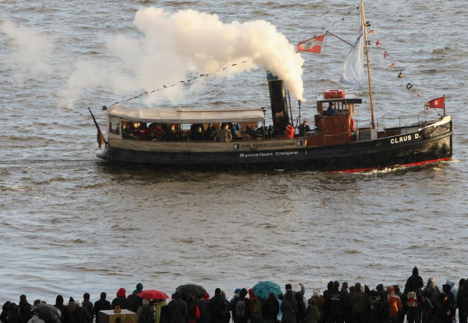 Visitors watch the tugboat Claus D.