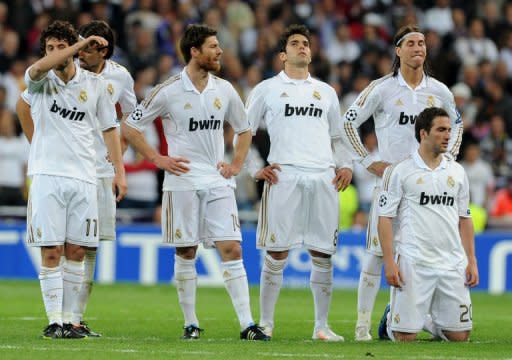 Real Madrid's players, pictured after the penalty shoot-out during their Champions League 2nd leg semi-final against Bayern Munich, at the Santiago Bernabeu in Madrid, on April 25. Spanish hopes of a mouth watering final between Real and Barcelona evaporated with both sides crashing out but at least Real have the consolation of being on the verge of claiming their first la liga title since 2008