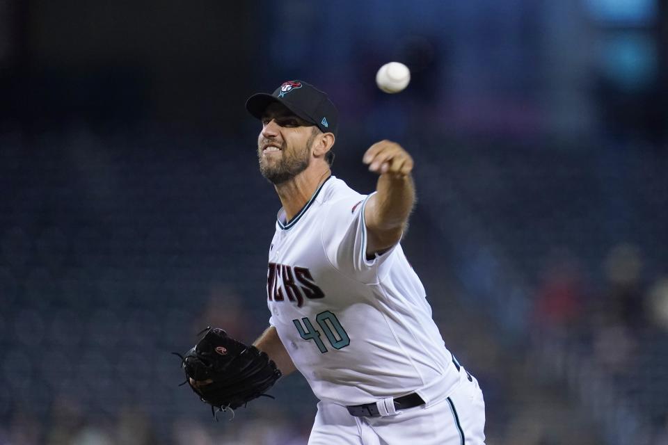 Arizona Diamondbacks starting pitcher Madison Bumgarner throws to a San Francisco Giants batter during the first inning of a baseball game Tuesday, Aug. 3, 2021, in Phoenix. (AP Photo/Ross D. Franklin)