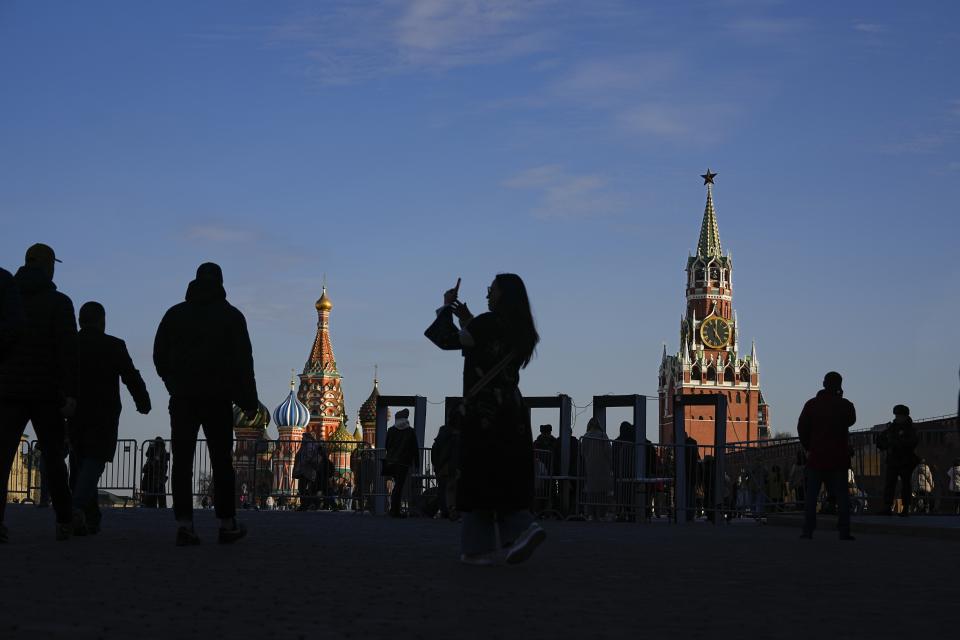 A woman takes a selfie on Red Square in Moscow, Russia, Thursday, March 28, 2024. The March 22 attack on a suburban Moscow concert hall that killed over 140 people marked a major failure of Russian security agencies. (AP Photo/Alexander Zemlianichenko)