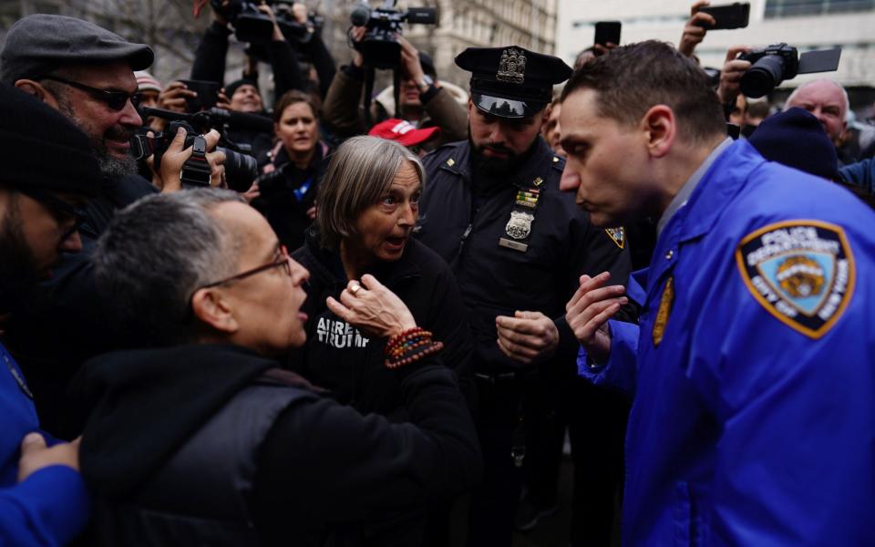 New York City Police officers try to keep pro and anti Trump demonstrators separated outside New York Criminal Court - WILL OLIVER/EPA-EFE/Shutterstock