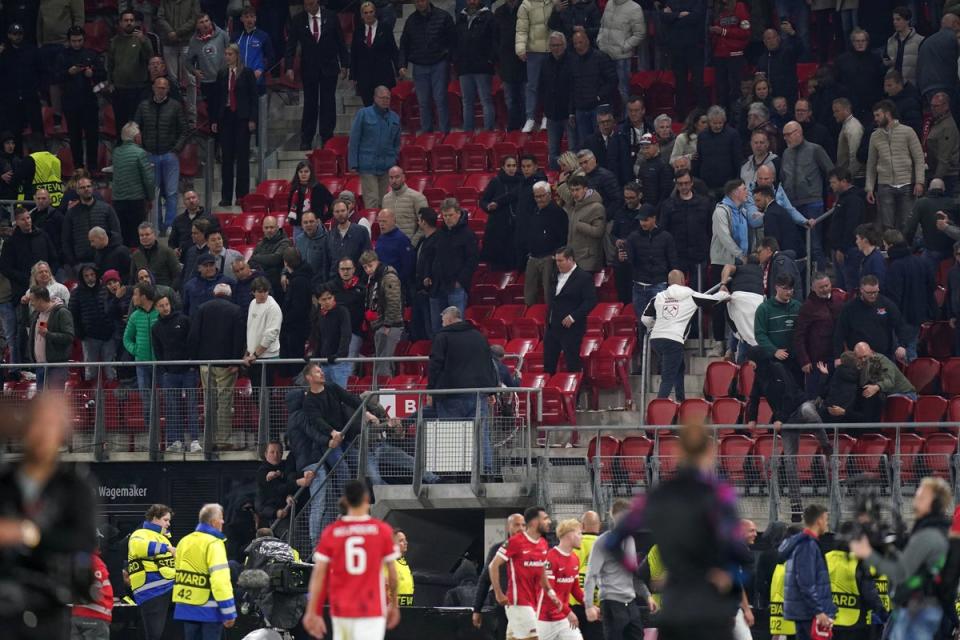 Ugly scenes: Alkmaar ultras appeared to have attacked West Ham fans after the full-time whistle (PA)