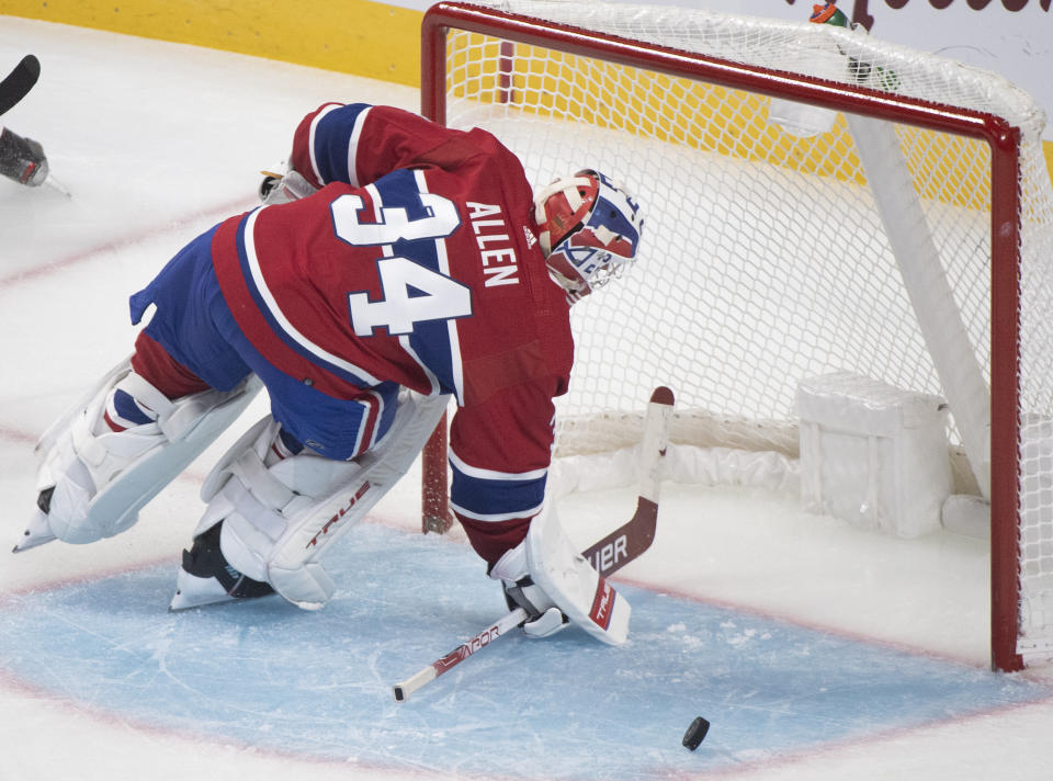 Montreal Canadiens goaltender Jake Allen gives up a goal to New York Rangers' Alexis Lafreniere during the third period of an NHL hockey game Saturday, Oct. 16, 2021, in Montreal. (Graham Hughes/The Canadian Press via AP)