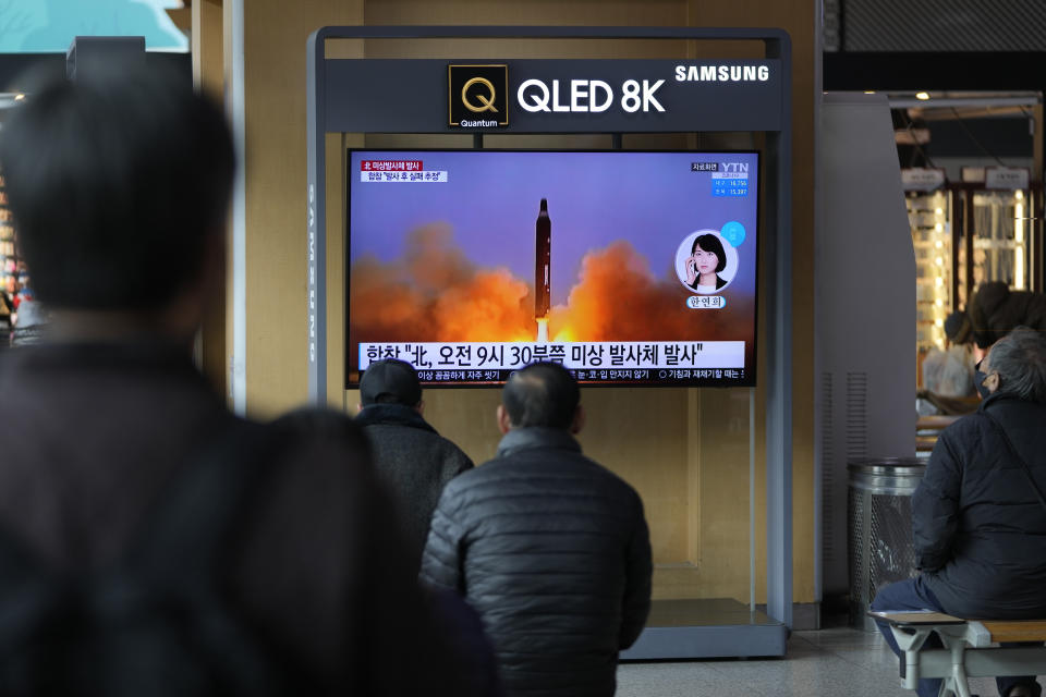 People watch a TV screen showing a news program reporting about North Korea's missile with file footage, at a train station in Seoul, South Korea, Wednesday, March 16, 2022. North Korea's latest weapons launch on Wednesday apparently ended in failure, South Korea' military said, amid speculation that the North could soon launch its biggest long-range missile in its most significant provocation in years. (AP Photo/Lee Jin-man)