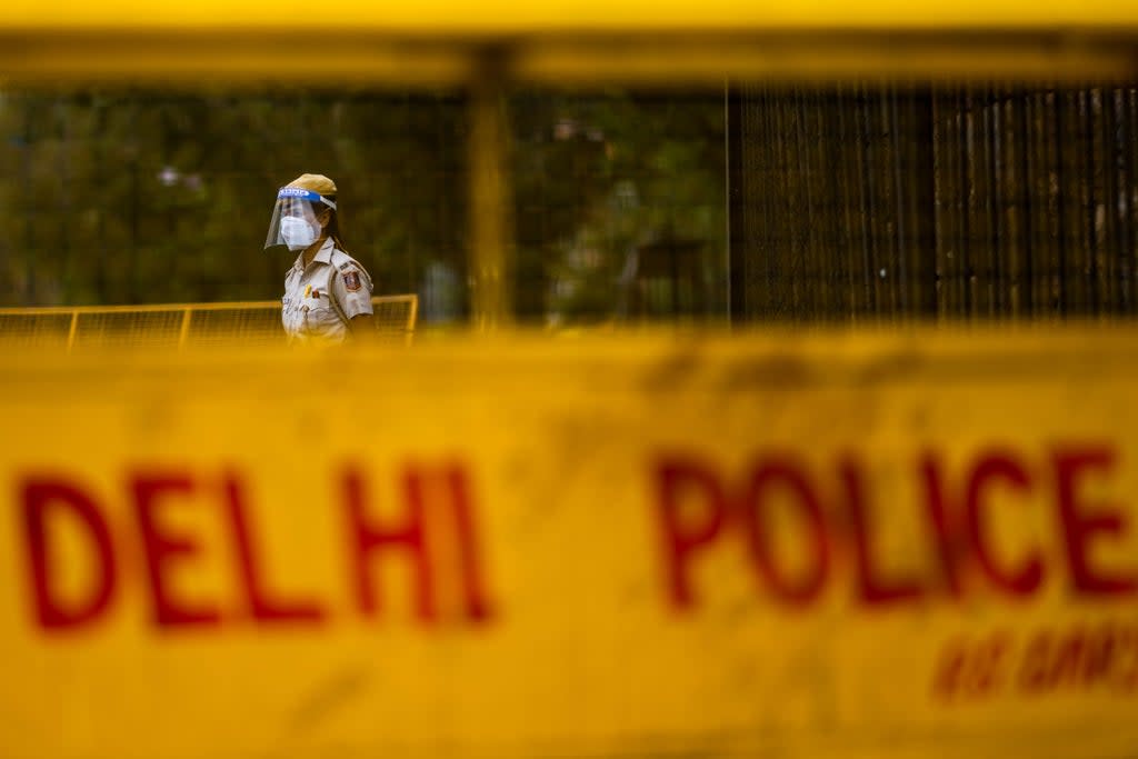 File: A police officer stands guard at a roadblock in Delhi on 20 April, 2021 (AFP via Getty Images)