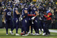 Tennessee Titans tight end Austin Hooper. center right, celebrates with teammates after catching a touchdown pass thrown by running back Derrick Henry during the second half of an NFL football game against the Green Bay Packers Thursday, Nov. 17, 2022, in Green Bay, Wis. (AP Photo/Matt Ludtke)