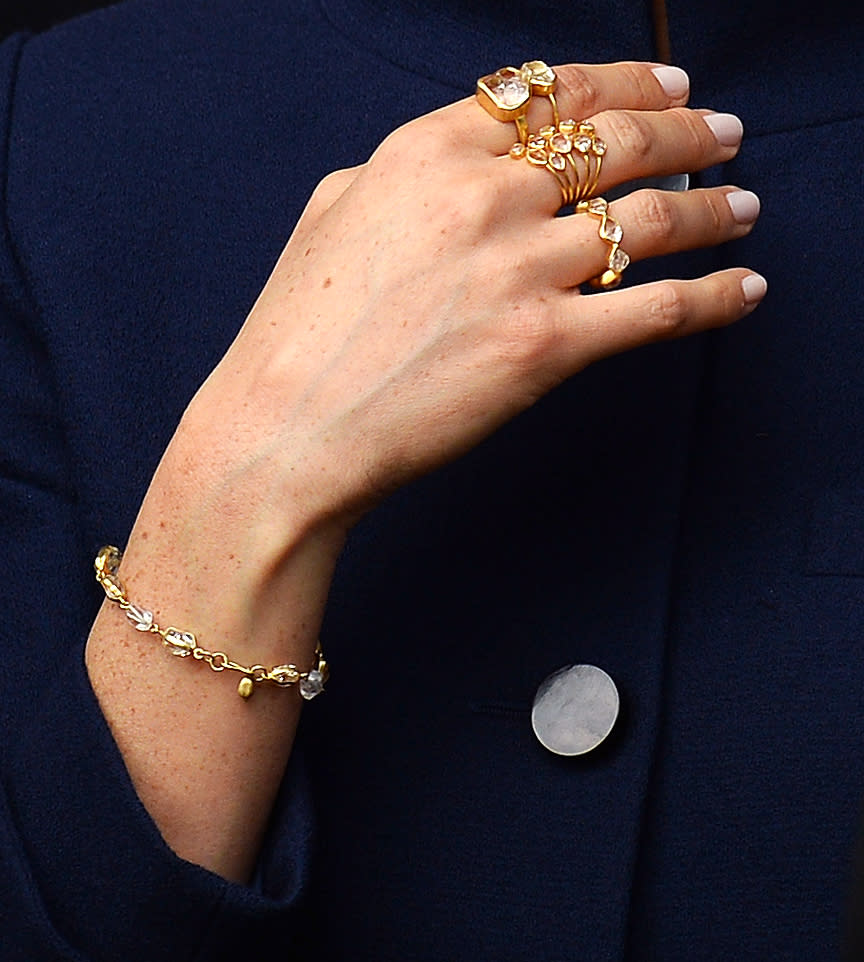 The Duchess of Sussex demonstrated her fashion know-how with stacks of rings at Princess Eugenie's wedding [Photo: Getty]