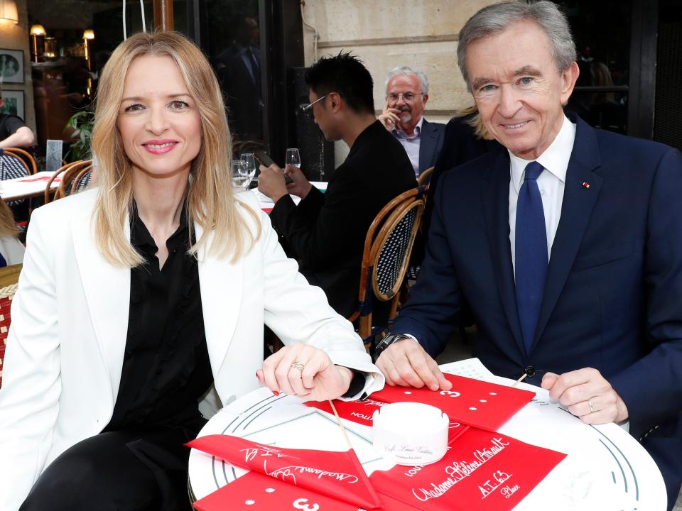 Louis Vuitton's executive vice president Delphine Arnault and Owner of LVMH Luxury Group Bernard Arnault attend the Louis Vuitton Menswear Spring Summer 2020 show as part of Paris Fashion Week on June 20, 2019 in Paris, France.