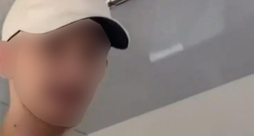 Pictured is a blurred picture of the man accused of punching a 15-year-old boy. 