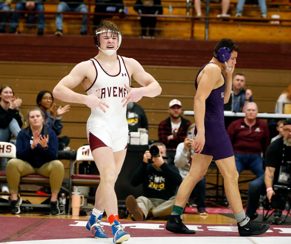 Mishawaka senior Beau Brabender, left, celebrates after defeating Merrillville's Adrian Mellot in the 157-pound championship match at the Al Smith Classic Wrestling Invitational Saturday, Dec. 30, 2023, at Mishawaka High School.