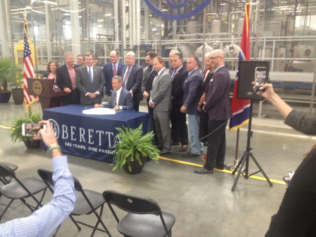 Flanked by legislative leaders, Gov. Bill Lee signs - for the second time -a law permitting permitless gun carry. (Photo: Sam Stockard)