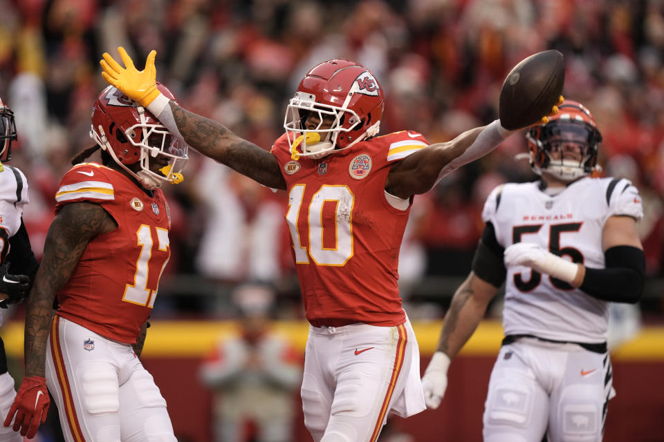Kansas City Chiefs running back Isiah Pacheco (10) celebrates after catching an 8-yard touchdown pass during the first half of an NFL football game against the Cincinnati Bengals Sunday, Dec. 31, 2023, in Kansas City, Mo. (AP Photo/Charlie Riedel)