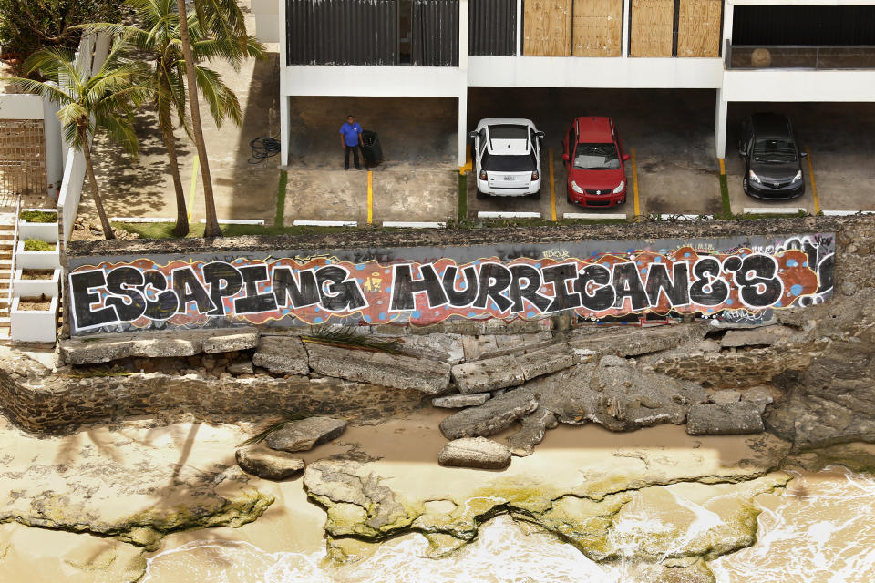 <p>Nearly one week after hurricane Maria devastated the island of Puerto Rico, residents are still trying to get the basics of food, water, gas, and money from banks in San Juan, Puerto Rico, Sept. 25, 2017. Much of the damage done was to electrical wires, fallen trees, and flattened vegetation, in addition to home wooden roofs torn off. (Photo: Carolyn Cole/Los Angeles Times via Getty Images) </p>