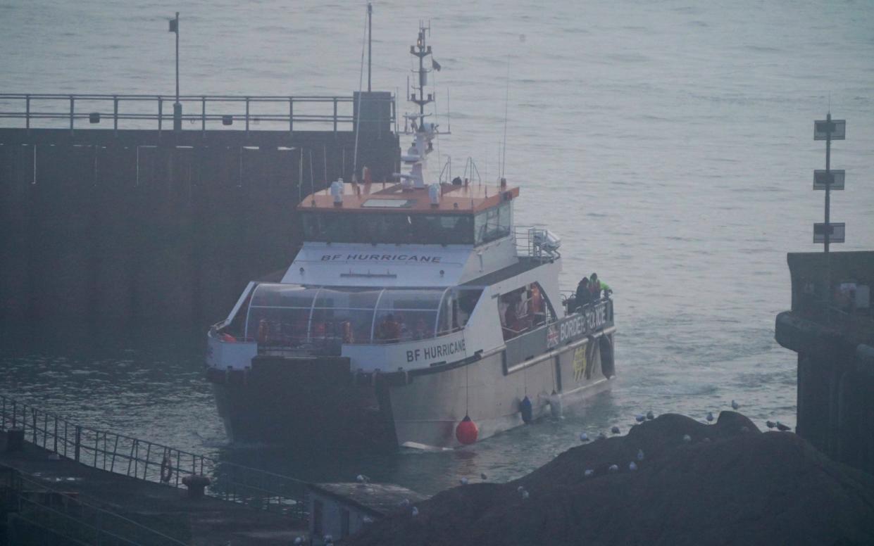 A group of people thought to be migrants are brought in to Dover