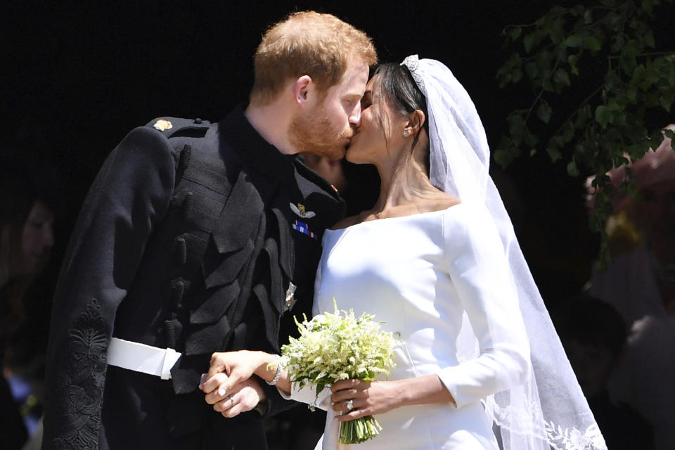 After the ceremony, Prince Harry and his wife Meghan Markle had a quick discussion before their kiss. Source: Ben Stansall/pool photo via AP