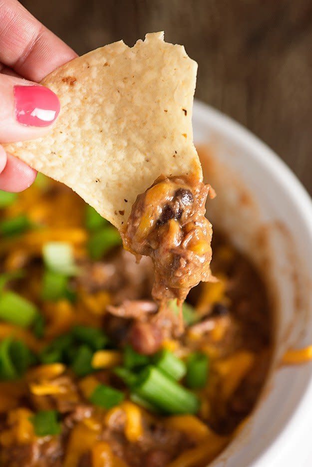 <strong>Get the <a href="https://www.bunsinmyoven.com/2015/10/15/beef-burrito-dip/" target="_blank">Slow Cooker Beef Burrito Dip</a> recipe from Buns In My Oven</strong>