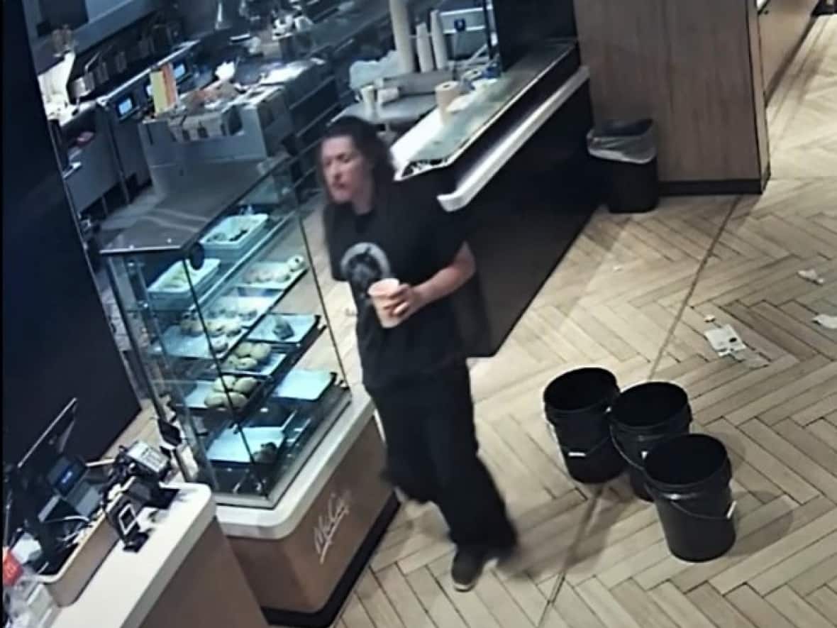 Police are looking for this man in connection with the second arson. (Charlottetown Police - image credit)