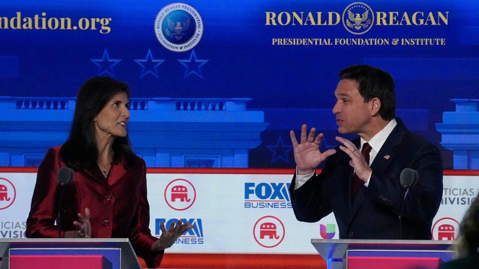 Former U.N. Ambassador Nikki Haley, left, argues a point with Florida Gov. Ron DeSantis during a Republican presidential primary debate hosted by FOX Business Network and Univision, Wednesday, Sept. 27, 2023, at the Ronald Reagan Presidential Library in Simi Valley, Calif.