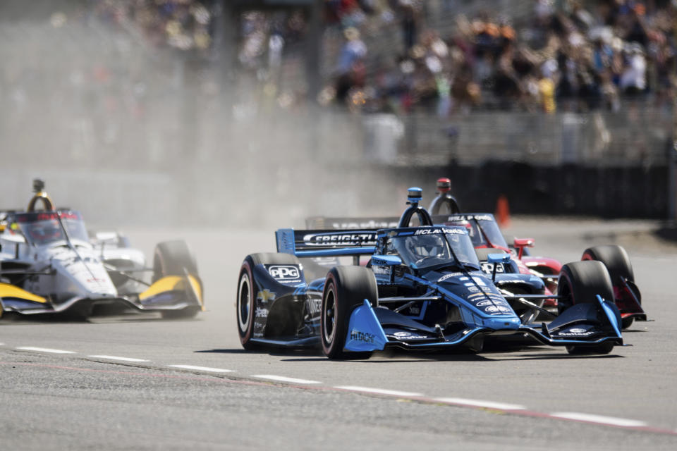 Scott McLaughlin, front, competes at the Grand Prix of Portland IndyCar auto race at the Portland International Raceway in Portland, Ore., on Sunday, Sept. 4, 2022. (Naji Saker/The Oregonian via AP)