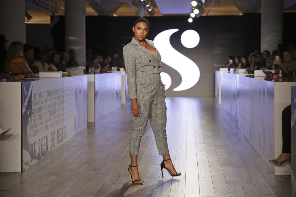 A model wears clothes by Serena Williams during Fashion Week in New York, Tuesday, Sept. 10, 2019. (AP Photo/Seth Wenig)