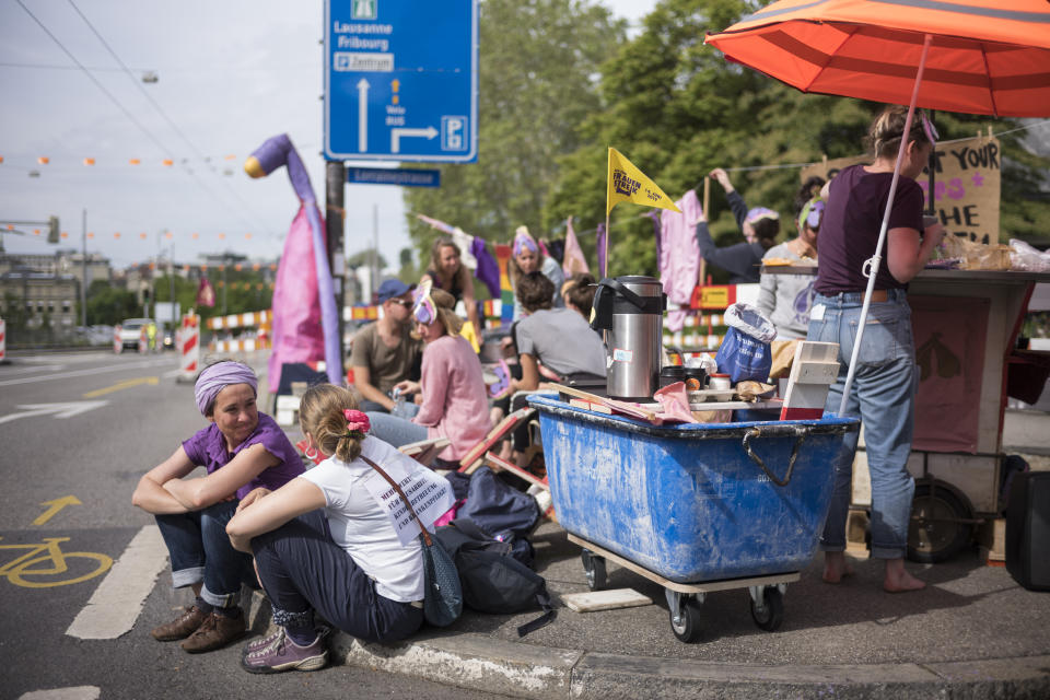 Women protest during a nationwide women's strike on Friday, June 14, 2019, in Bern, Switzerland. There is list of several reasons motivating people to take part in the strike. These range from unequal wages to pressures on part-time employees, the burden of household work and sexual violence. (Alessandro della Valle/Keystone via AP)