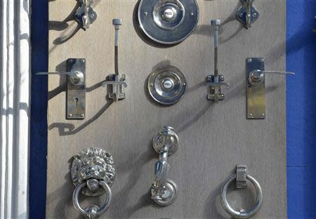 Bells, handles and buzzers for front doors are seen for sale at a shop in central London October 8, 2013. REUTERS/Toby Melville