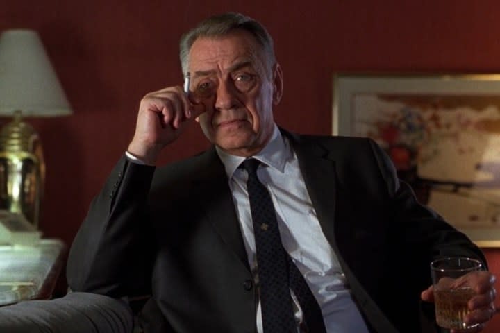 Philip Baker Hall holds a cigarette in Hard Eight.