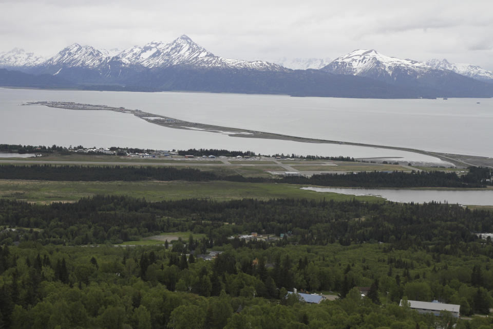 Homer, Alaska, and the Homer Spit, jutting out into Kachemak Bay, is seen on June 9, 2021. Alaska State Troopers say a 70-year-old Homer man attempting to take photos of newborn moose calves was attacked and killed by the calves' mother in Homer on Sunday, May 19, 2024. / Credit: Mark Thiessen / AP