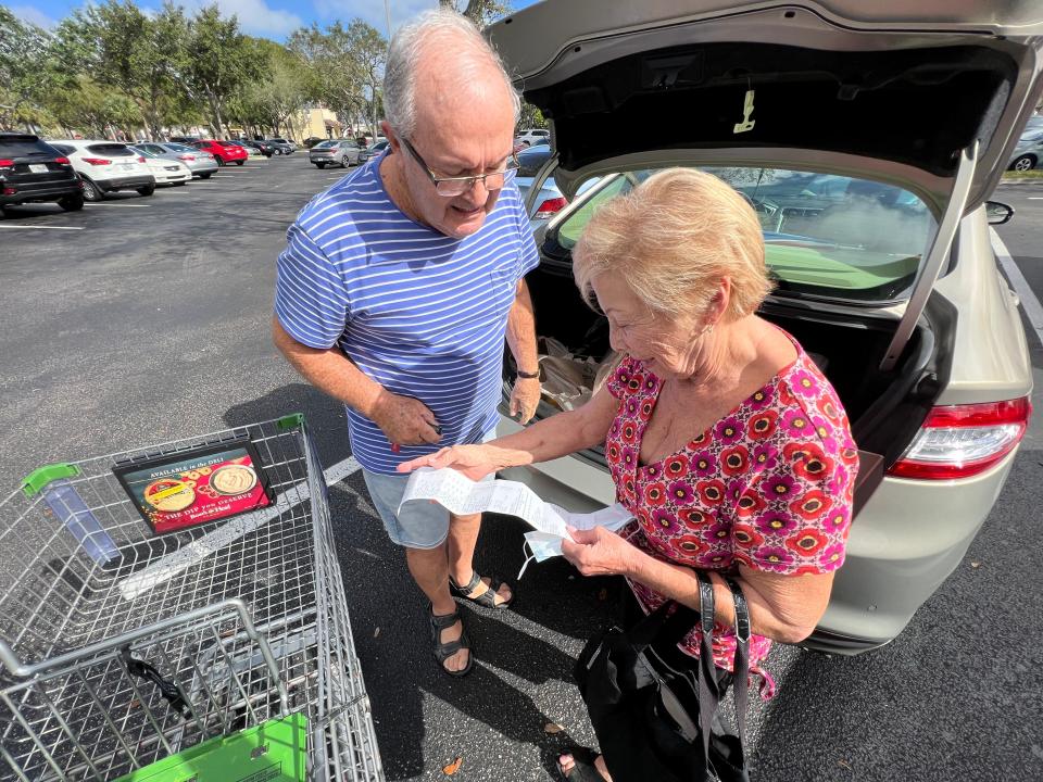 Alan and Marion Winokur look at their receipt from a recent shopping trip at Publix in suburban Boynton Beach. “Every time we go to the supermarket, it’s like a nightmare surprise,” Marion said.