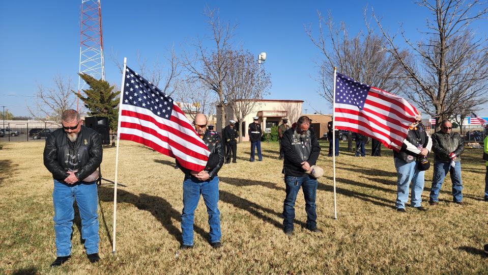 Veterans in attendance for the Missing In America Project's ceremony stand in prayer Wednesday at the Texas Panhandle War Memorial Center.