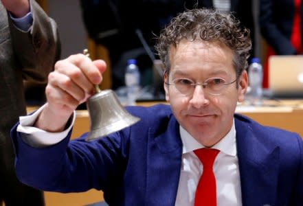 FILE PHOTO: Dutch Finance Minister and Eurogroup President Jeroen Dijsselbloem rings the bell as he chairs a Eurozone finance ministers meeting in Brussels, December 4, 2017. REUTERS/Francois Lenoir/File Photo