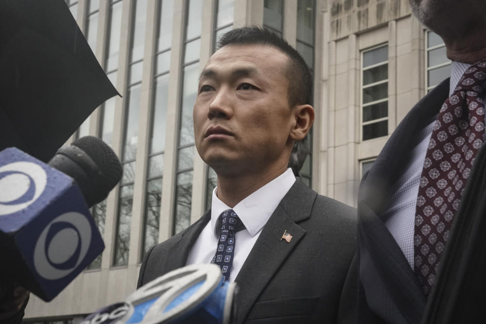 NYPD officer Baimadajie Angwang, a naturalized US citizen from Tibet, holds a news briefing outside Brooklyn's Federal court after a judge dismissed spy charges against him, Thursday Jan. 19, 2023, in New York. U.S. prosecutors dropped charges against Angwang, who authorities had initially accused of spying on independence-minded Tibetans on behalf of the Chinese consulate in New York. (AP Photo/Bebeto Matthews)