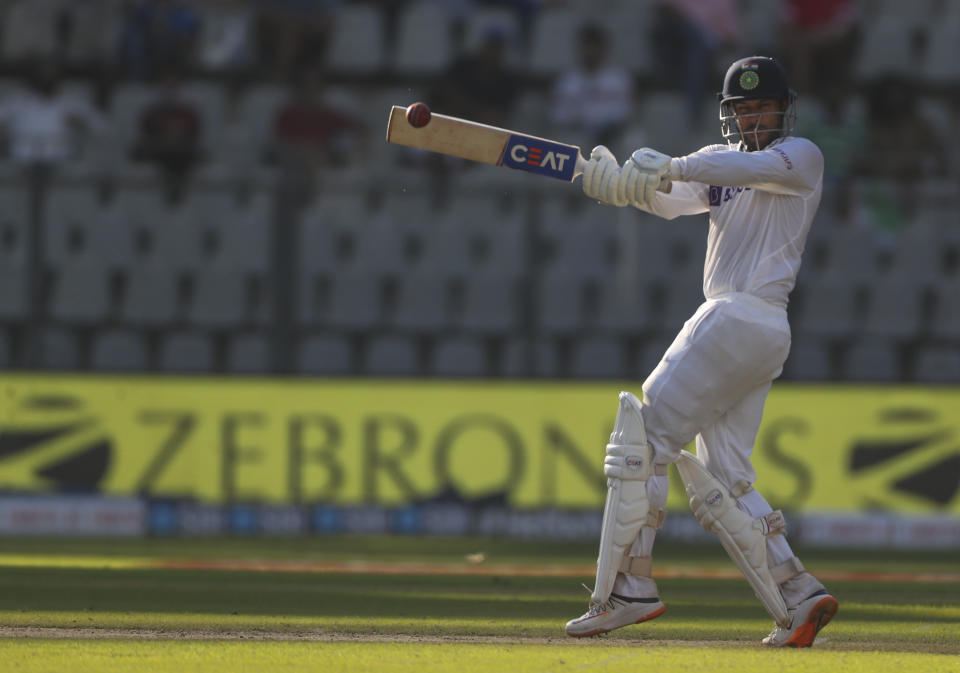 India's Mayank Agarwal plays shot during the day two of their second test cricket match with New Zealand in Mumbai, India, Saturday, Dec. 4, 2021.(AP Photo/Rafiq Maqbool)