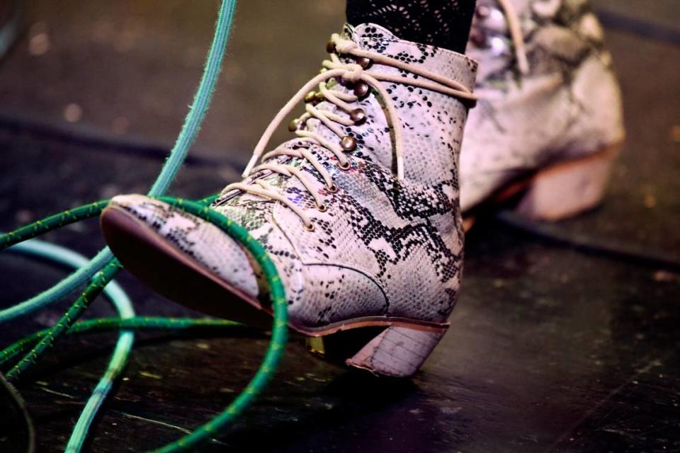 A musician’s boot keeps time among microphone cables during the Bluegrass Ramble in downtown Raleigh, N.C. Tuesday evening, Sept. 28, 2021.