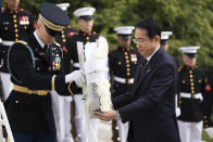 Japan's Prime Minister Fumio Kishida, lays a wreath at the Tomb of the Unknown Soldier, at Arlington National Cemetery, in Arlington, Va., Tuesday, April 9, 2024. (AP Photo/Manuel Balce Ceneta)