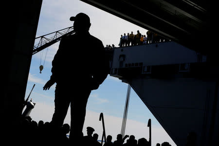 FILE PHOTO: U.S. President Donald Trump takes the stage in the flight hangar to deliver remarks aboard the pre-commissioned U.S. Navy aircraft carrier Gerald R. Ford at Huntington Ingalls Newport News Shipbuilding facilities in Newport News, Virginia, U.S. March 2, 2017. REUTERS/Jonathan Ernst/File Photo